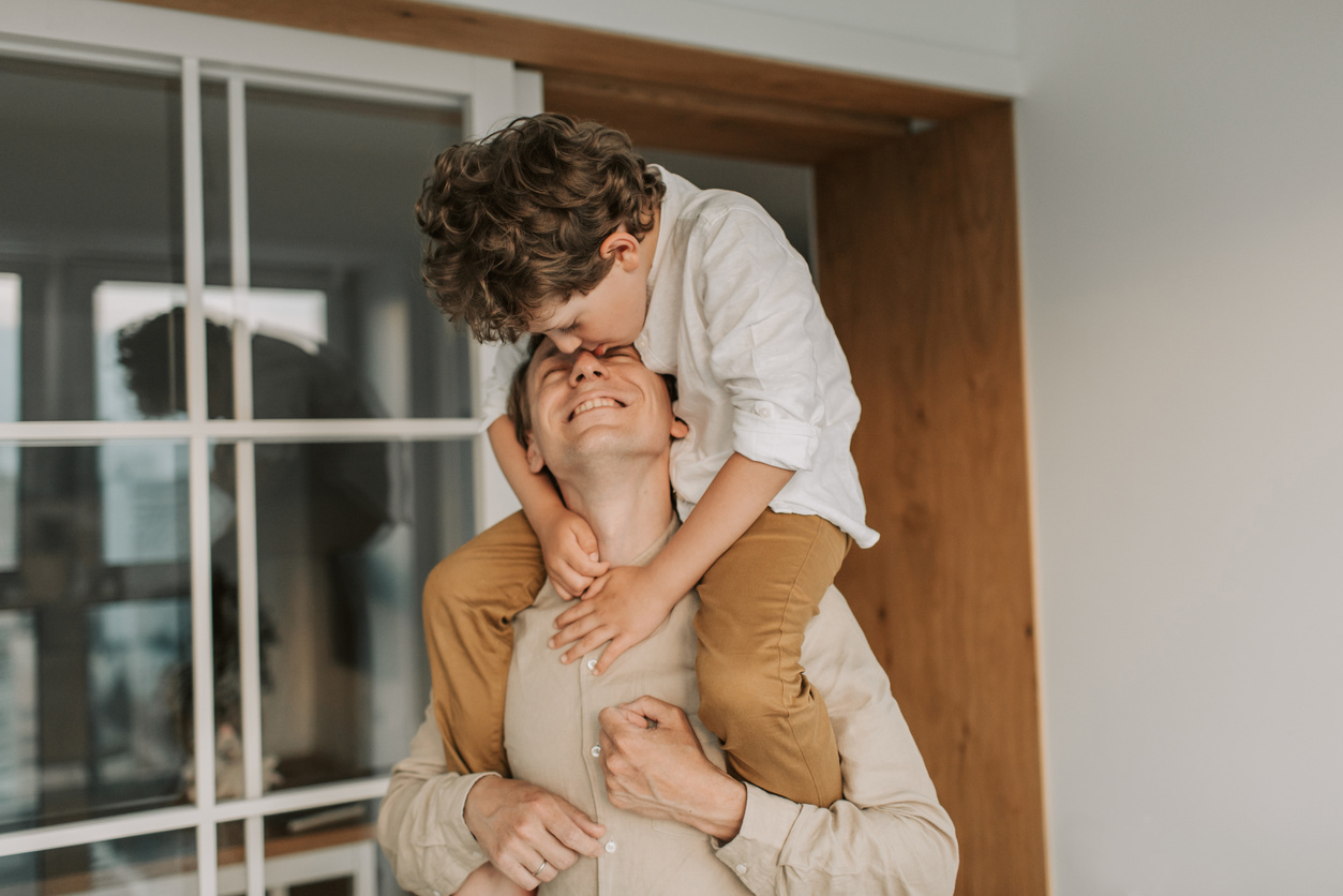 Man Carrying his Son on his Shoulders